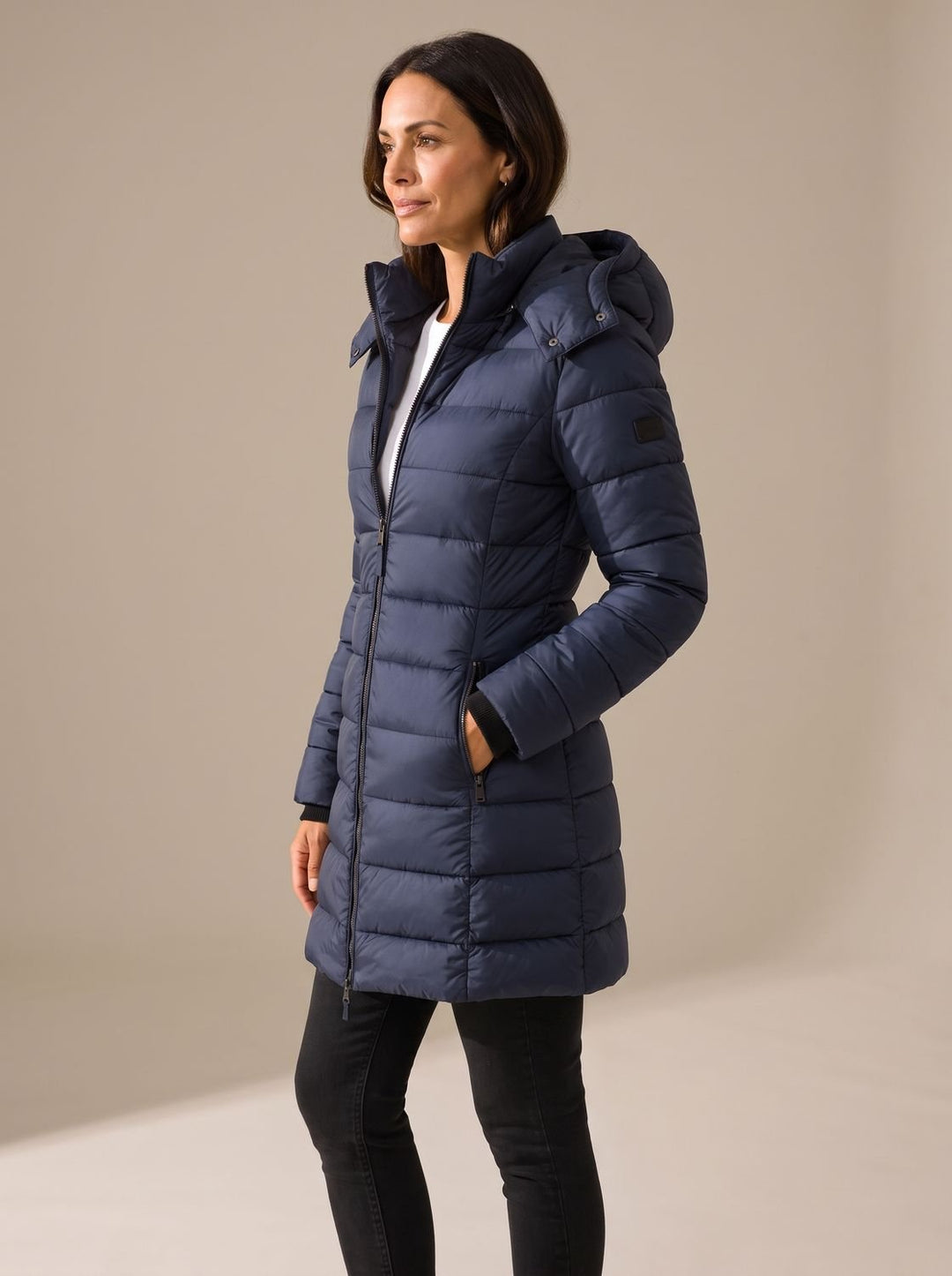 Quilted women's long puffer coat with hood